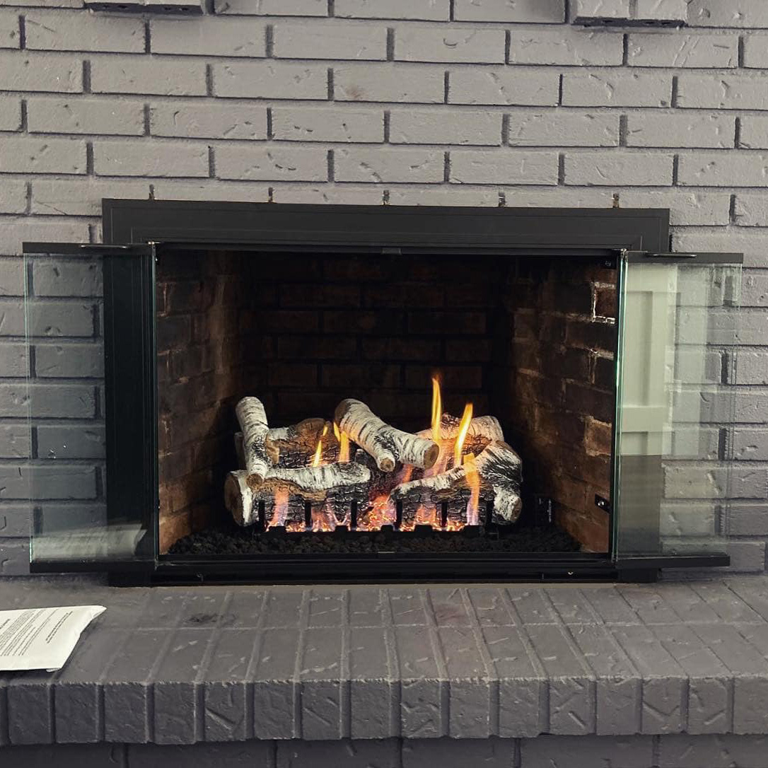 birch vent free ventless gas logs installed in a fireplace