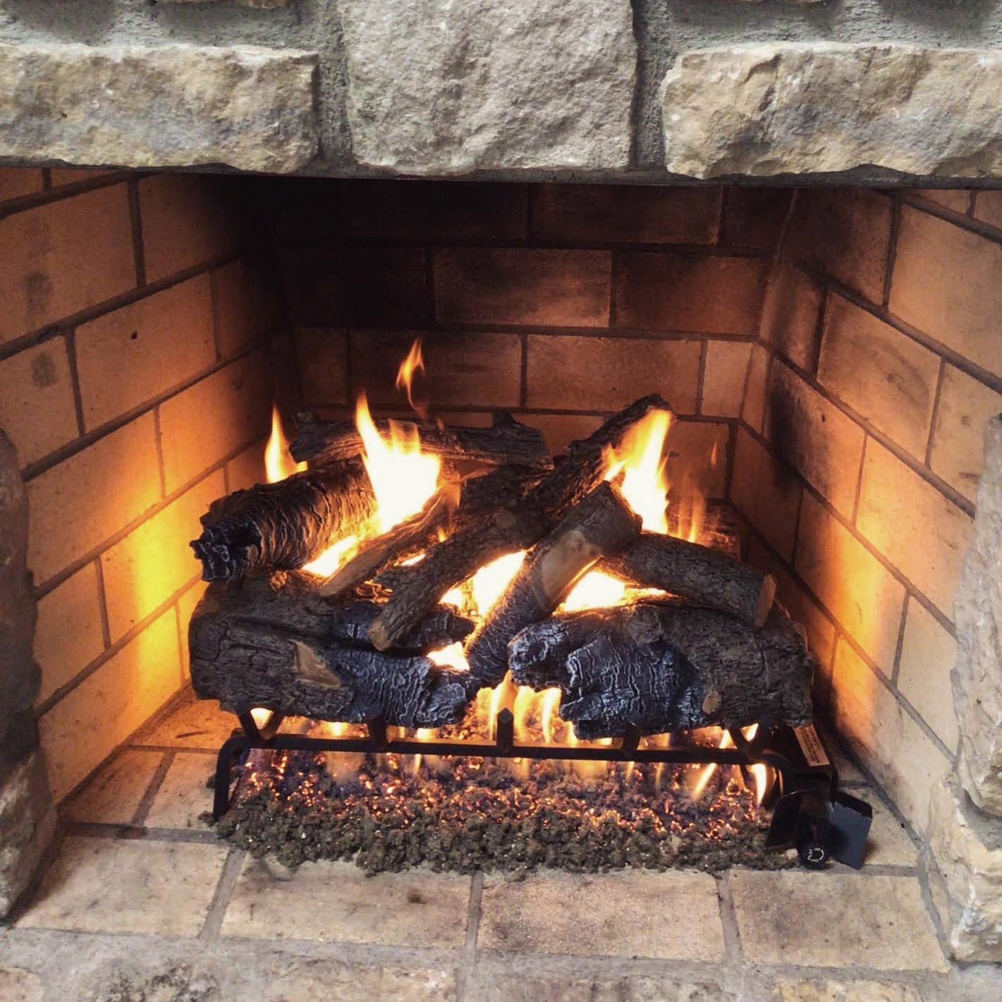 vented gas logs installed in a fireplace