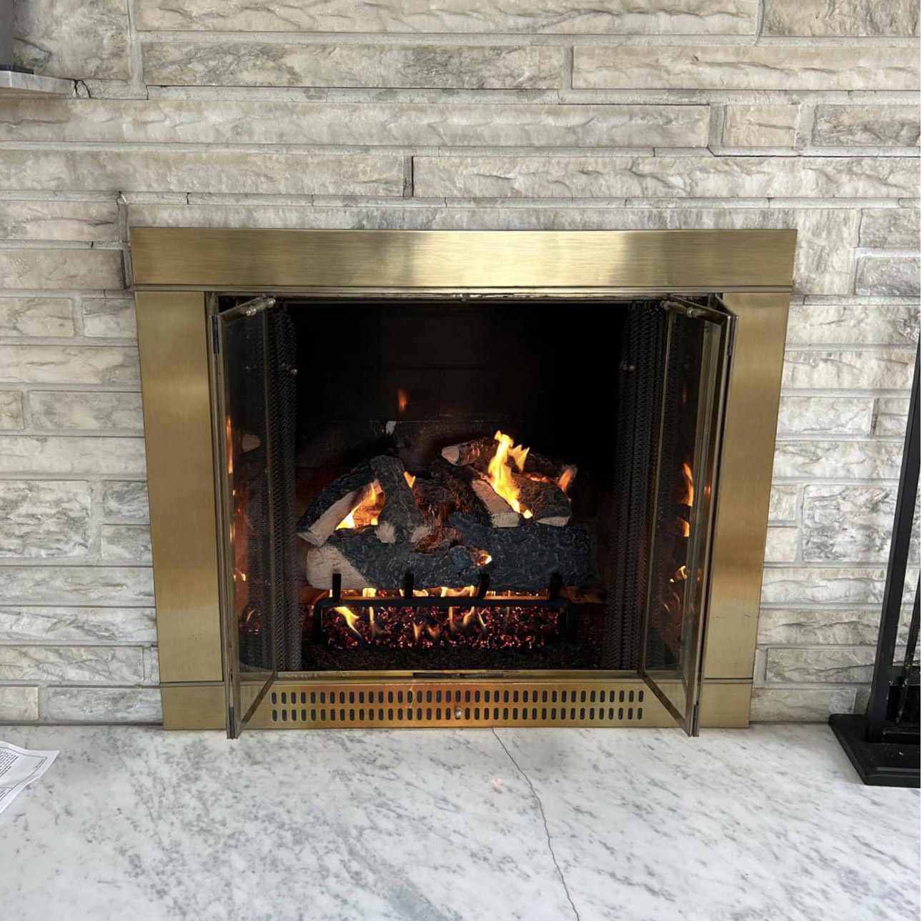 vented gas logs installed in a fireplace