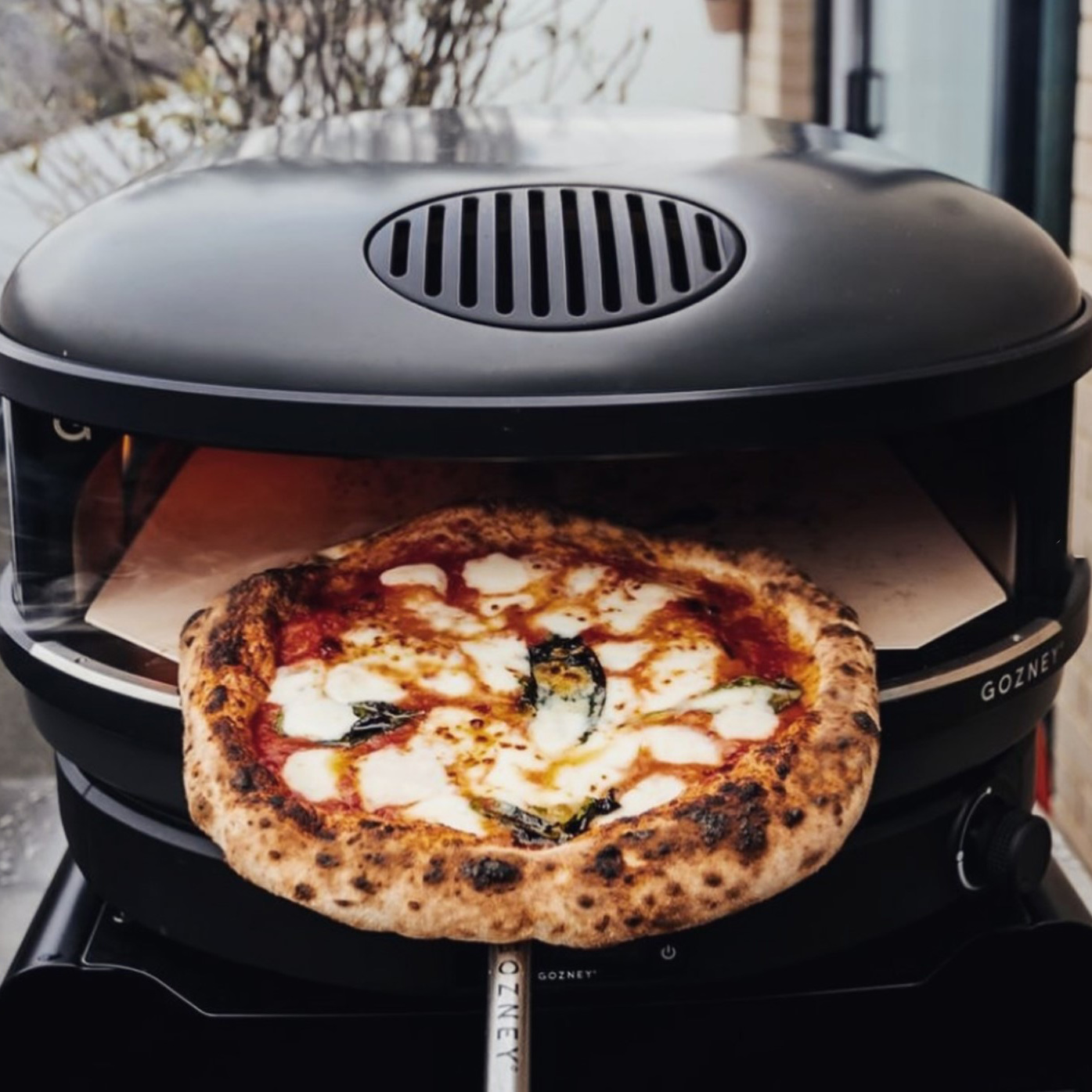 gozney arc xl  pizza oven matte black with pizza 